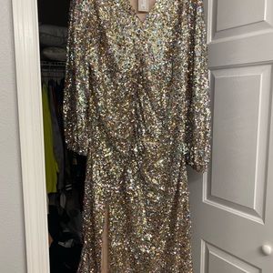 Brand new, never worn midi sequin dress with a side slit and rouching.